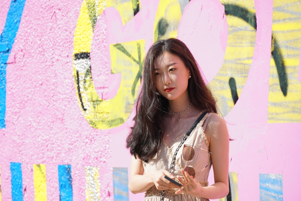 woman wearing pink and red sleeveless top