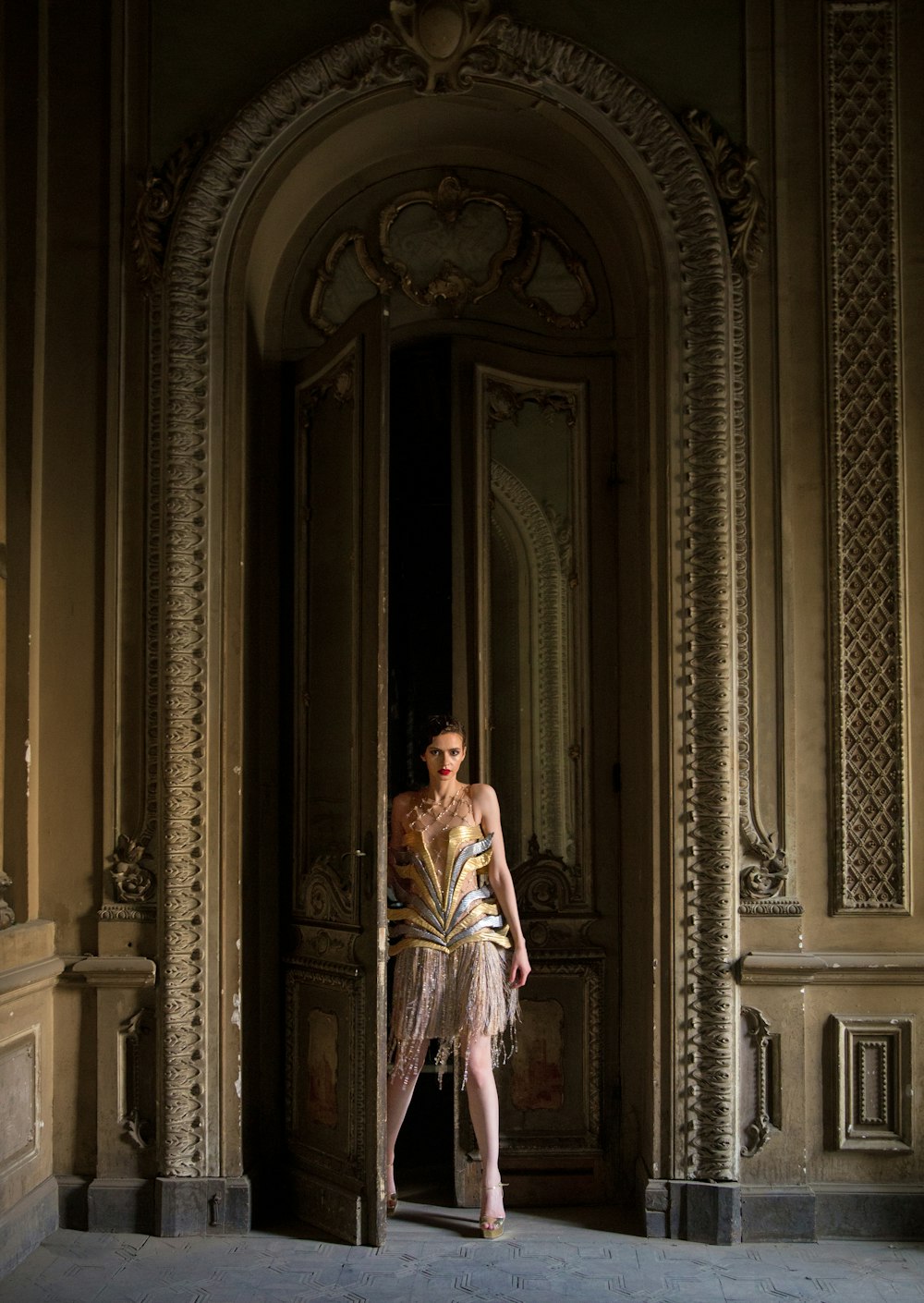 woman standing beside opened door