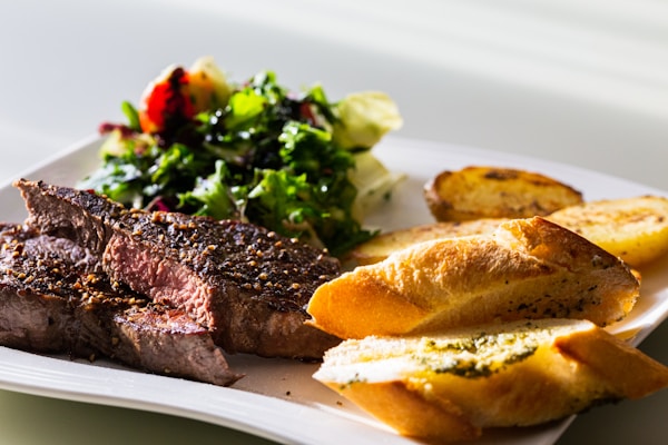 Cooked foods on white ceramic plate