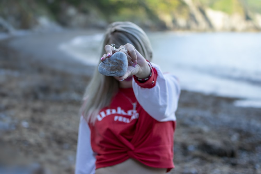 woman holding stone