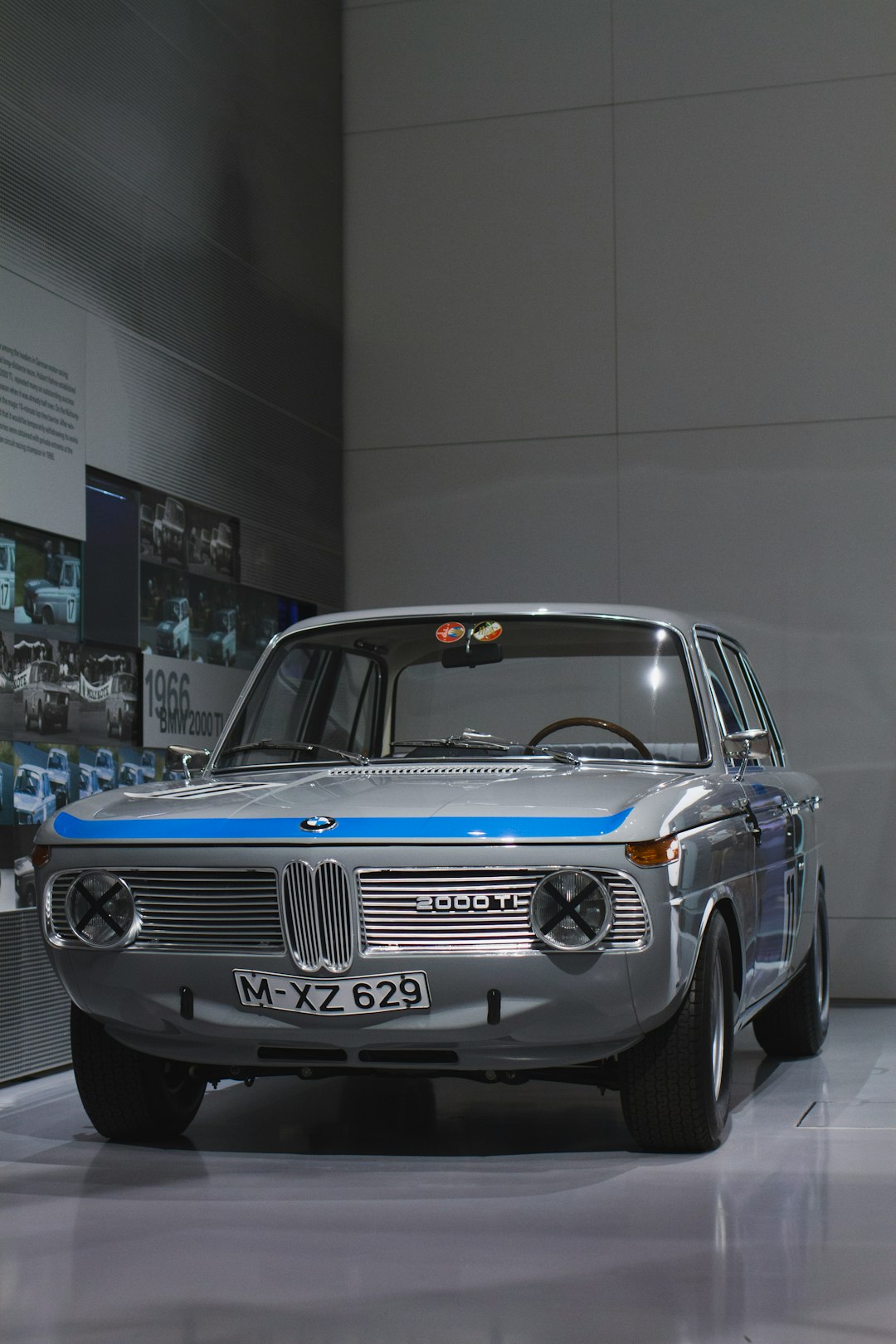 gray BMW sedan on display inside room