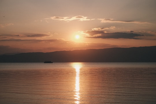 boat floating on the sea during golden hour in Ohrid North Macedonia