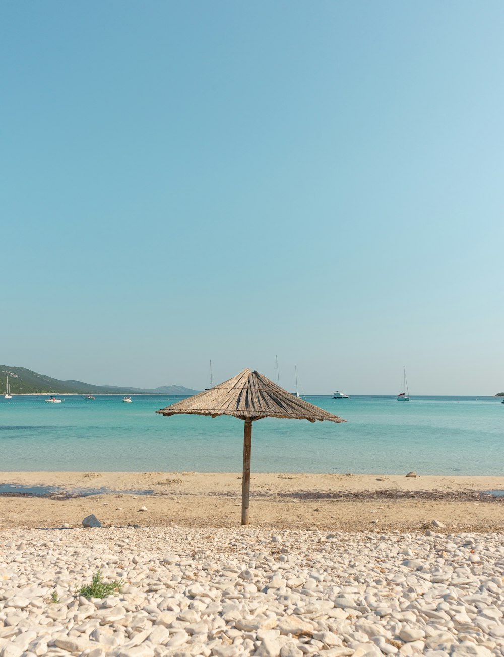 beige wooden parasol