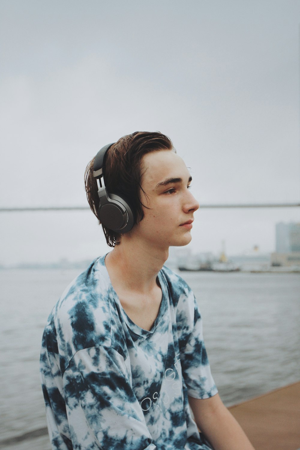 man wears black cordless headphones