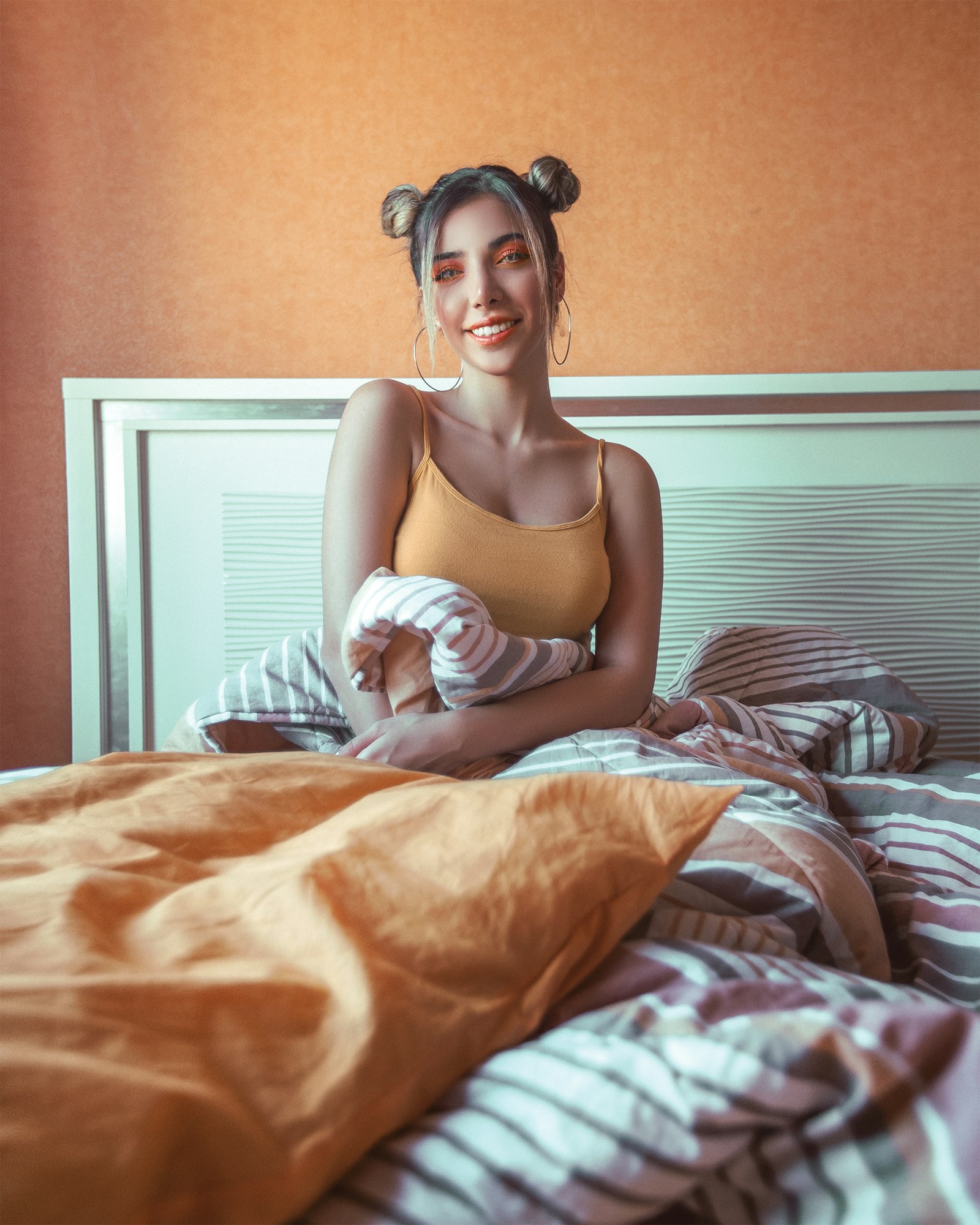 Canon EOS 5D Mark IV + Canon EF 16-35mm F2.8L II USM sample photo. Woman sitting on bed photography