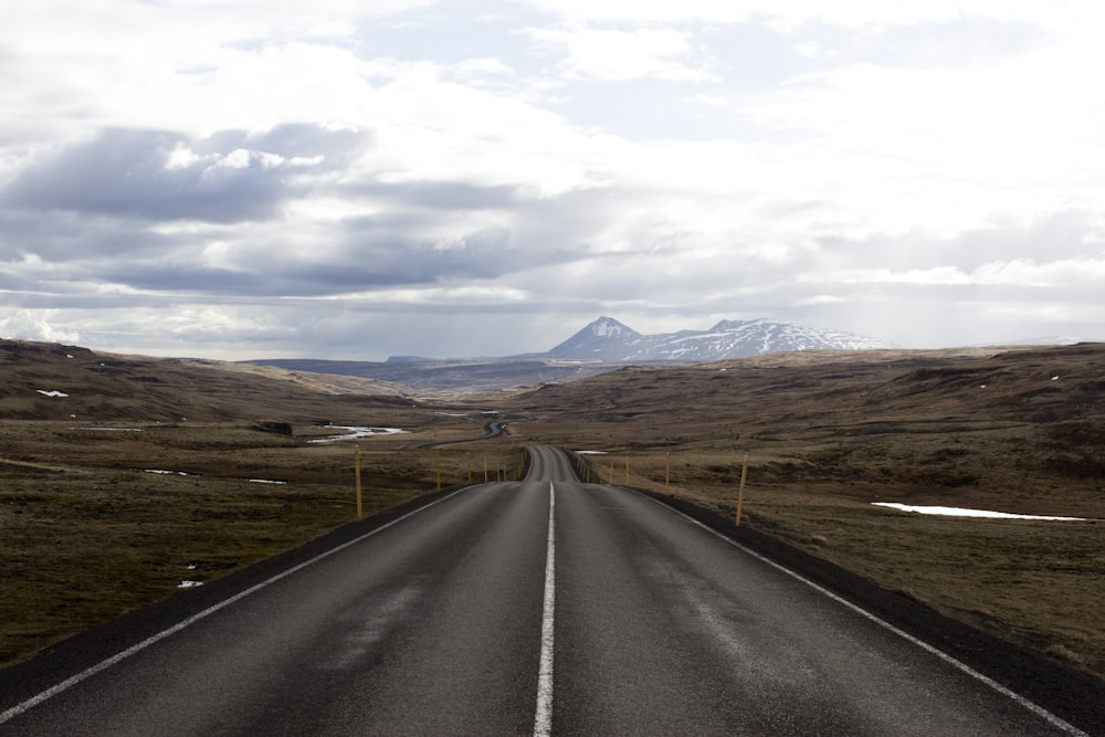 road near mountain during daytime