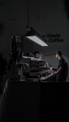 A robotic barista serving coffee in a modern café.