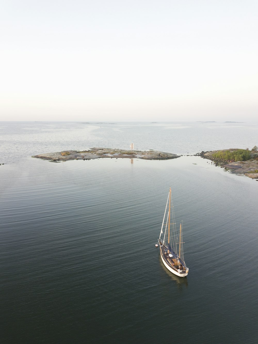 white boat near islan