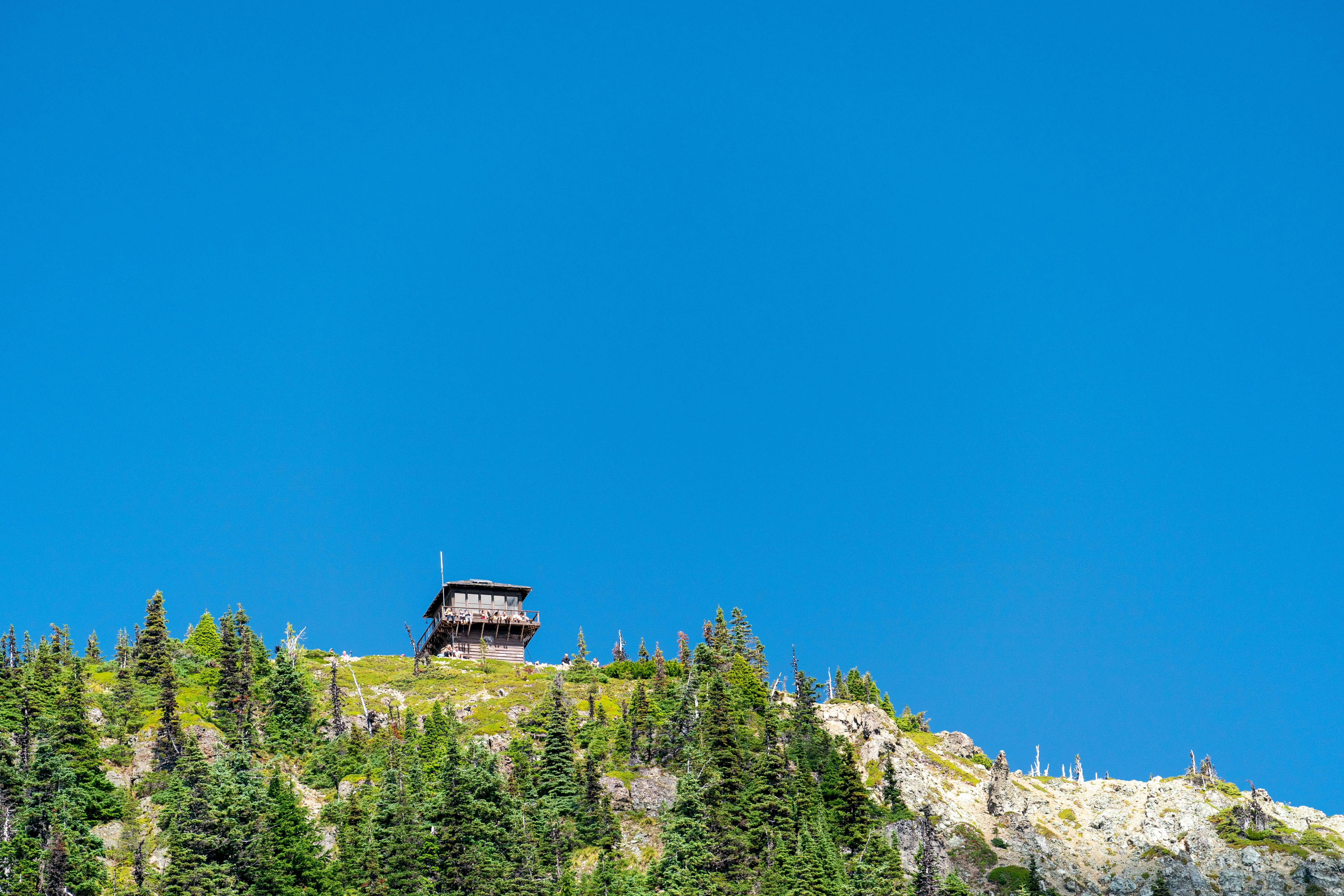 building on top of a mountain under blue sky during daytime
