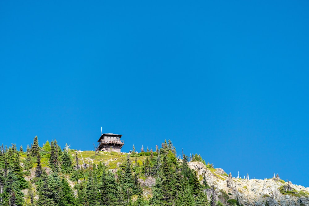 building on top of a mountain under blue sky during daytime