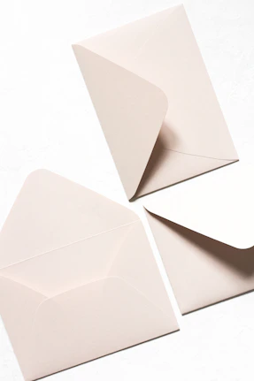 three white mail envelops