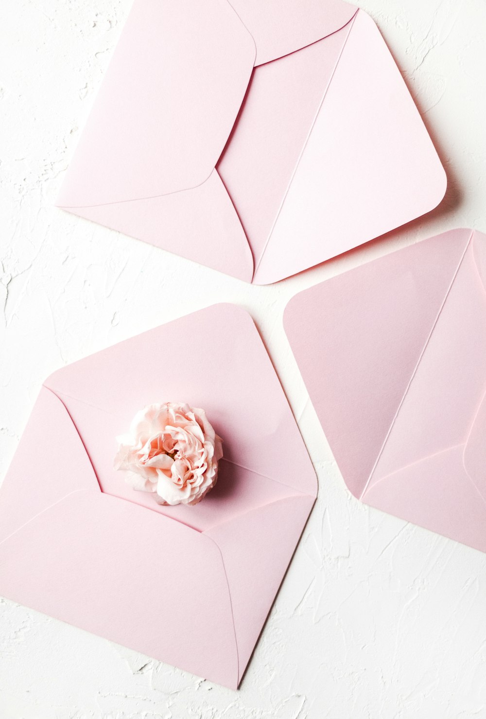 three pink envelopes