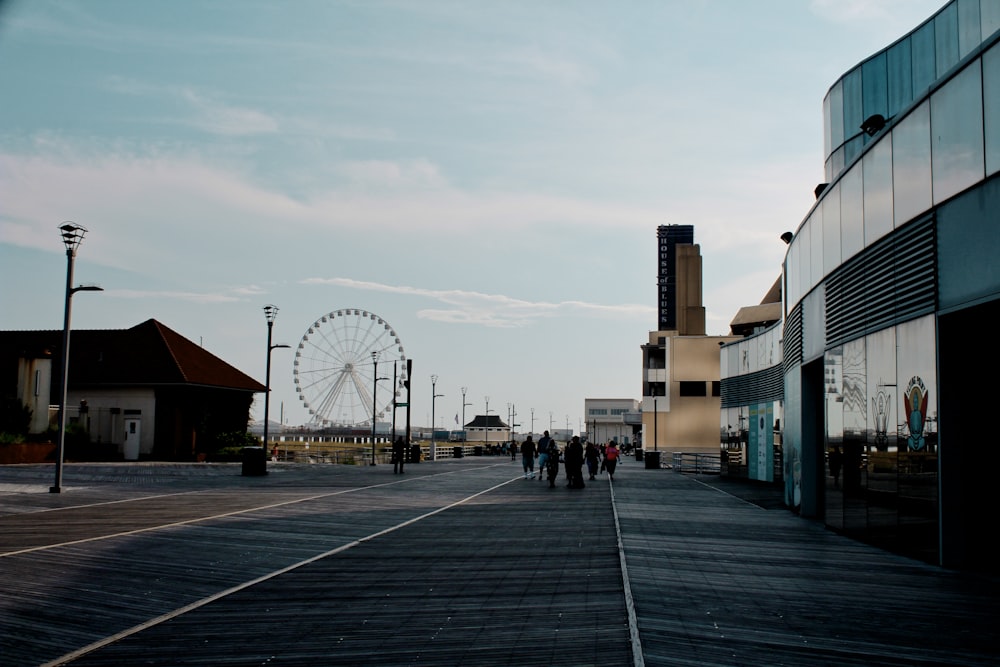 gray concrete structure near Ferris wheel