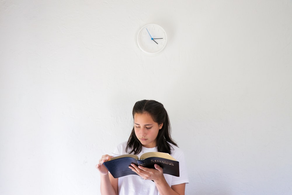 woman standing beside wall