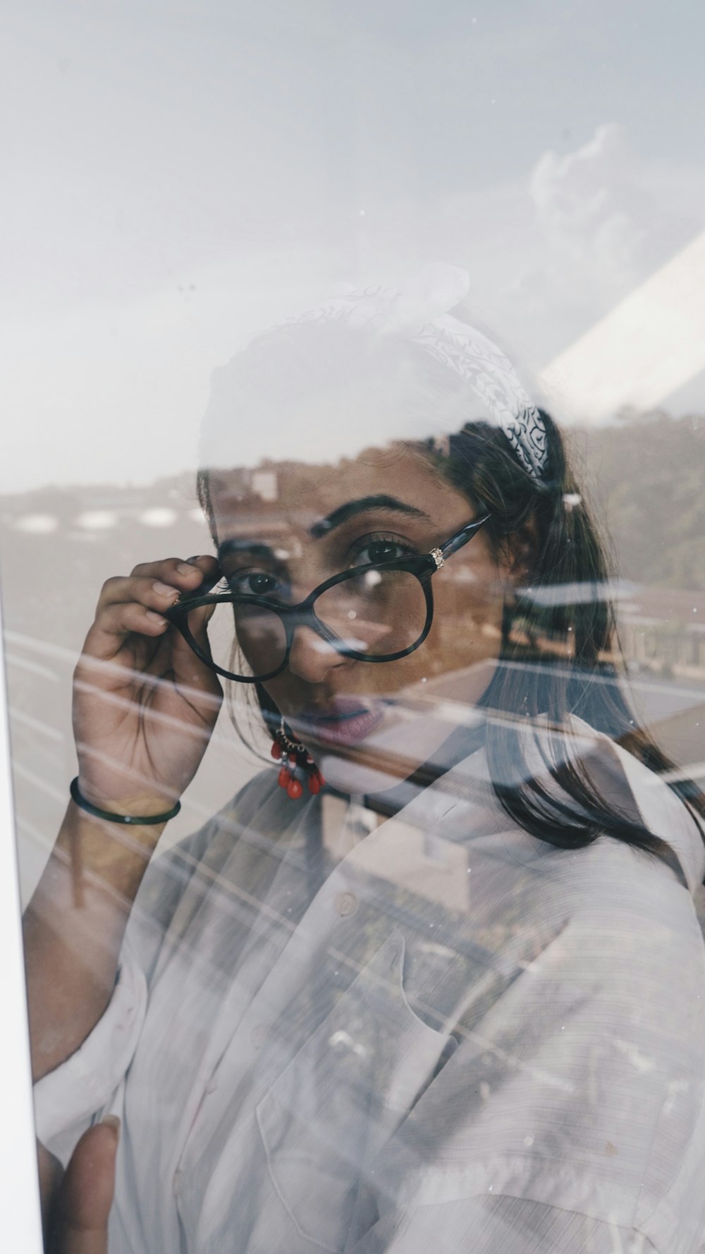 woman wearing black framed eyeglasses