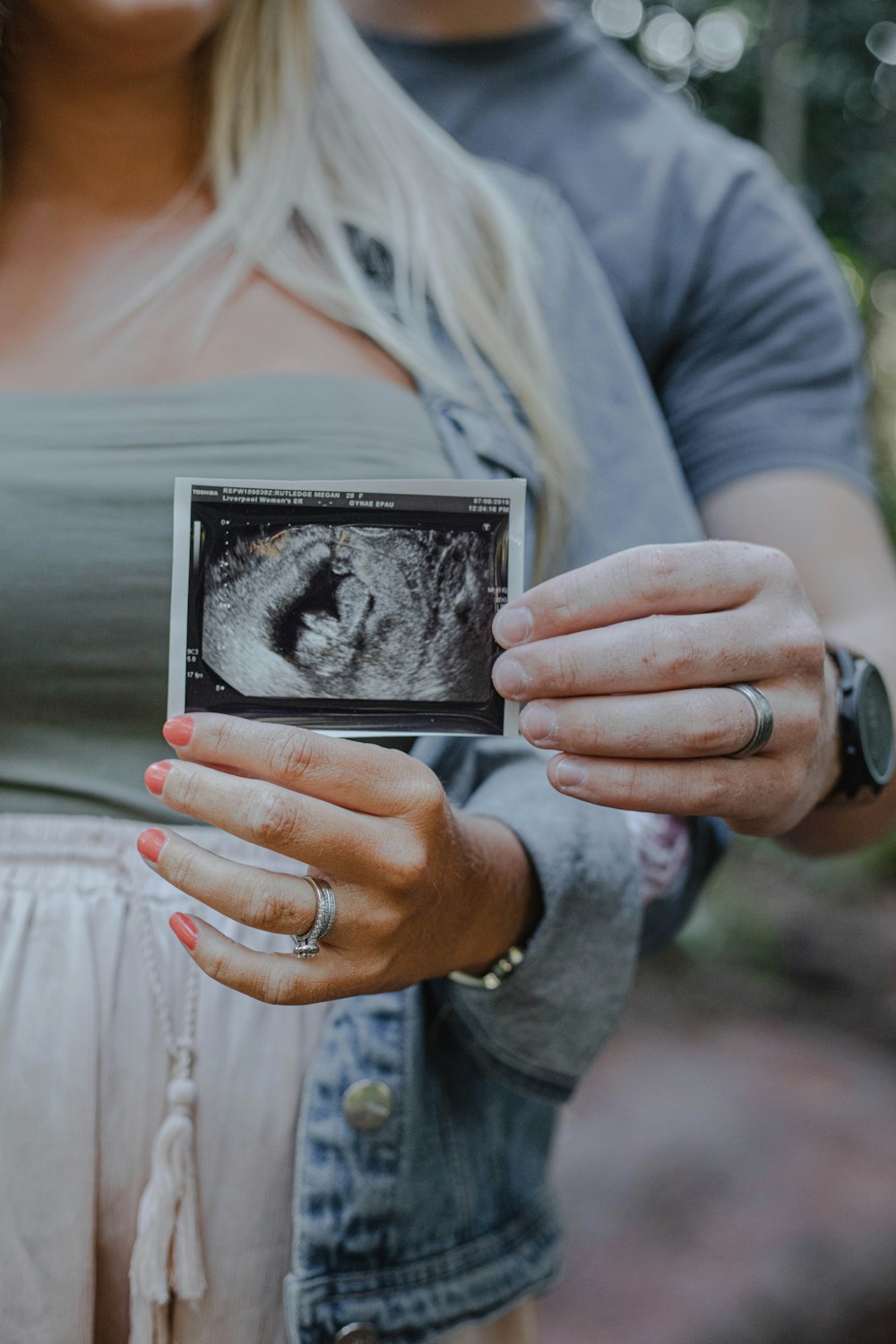 man and woman holding ultrasound result