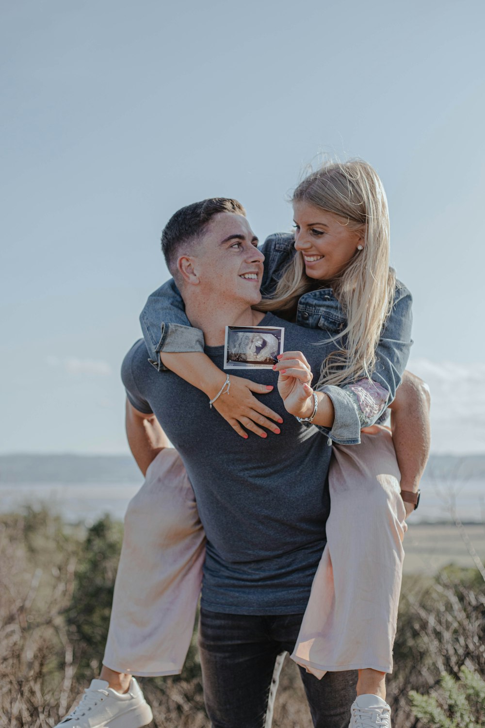 man carrying woman on back