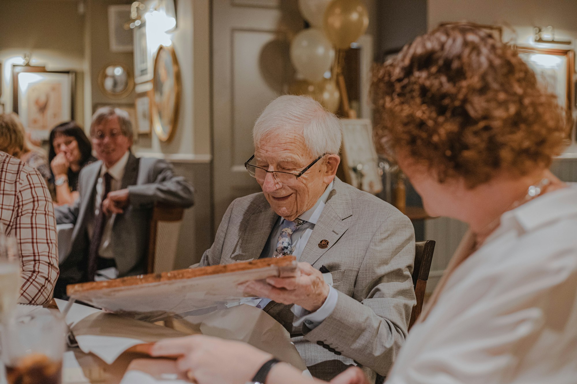 An elderly person at a birthday party