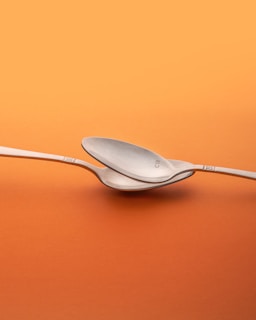 two grey spoons