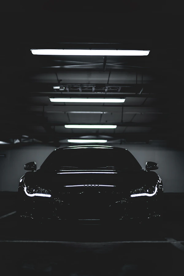 Oil change service being performed in clean garage bay