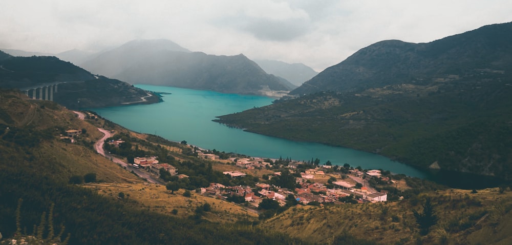 aerial view of houses beside lake