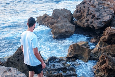 man standing on rock algeria google meet background