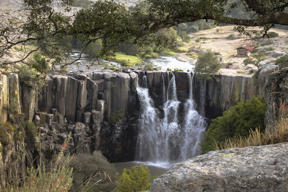 waterfalls between cliff