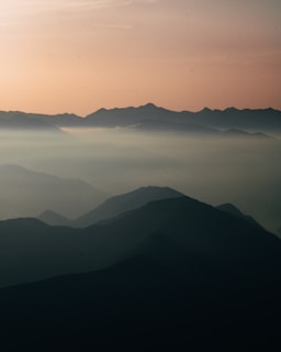 A serene cosmic landscape blending earth and spirit realms in soft, glowing hues.