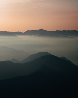 A serene cosmic landscape blending earth and spirit realms in soft, glowing hues.