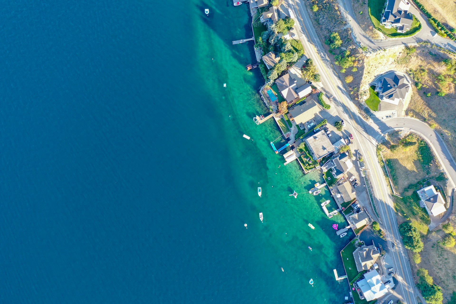 aerial photography of buildings beside sea during daytime