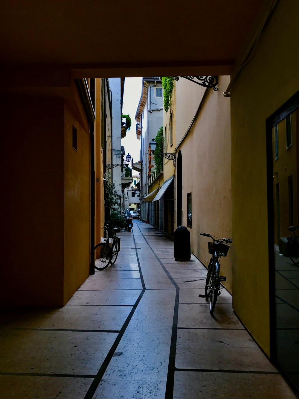 two bikes parked at the alley during day