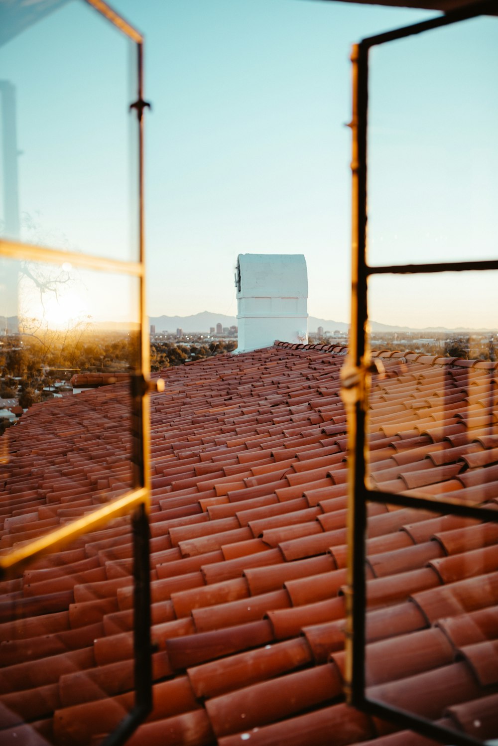 orange roof shingles during daytime