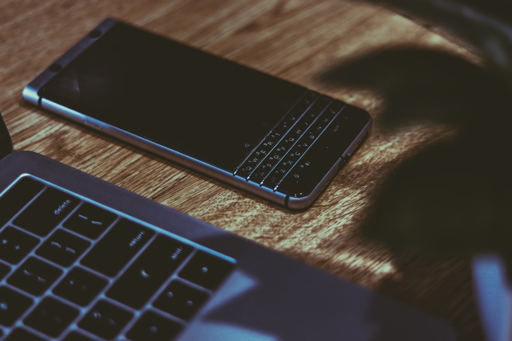 silver and black QWERTY phone