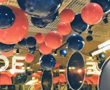 Corporate event space decorated with sleek, modern balloon installations.