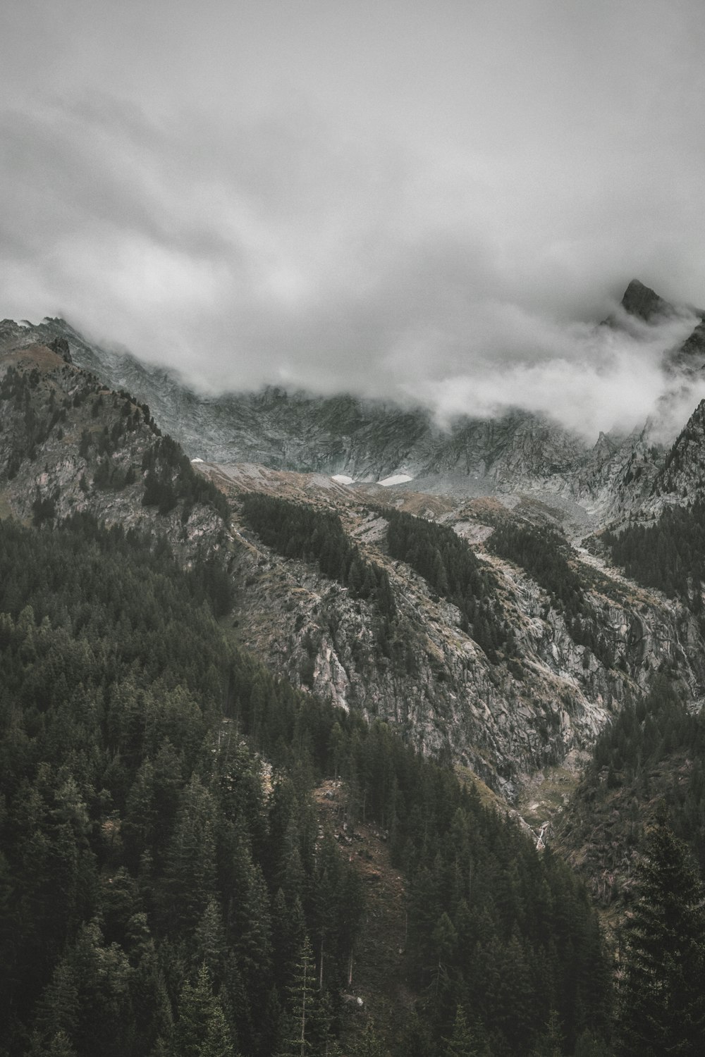 a black and white photo of a mountain range