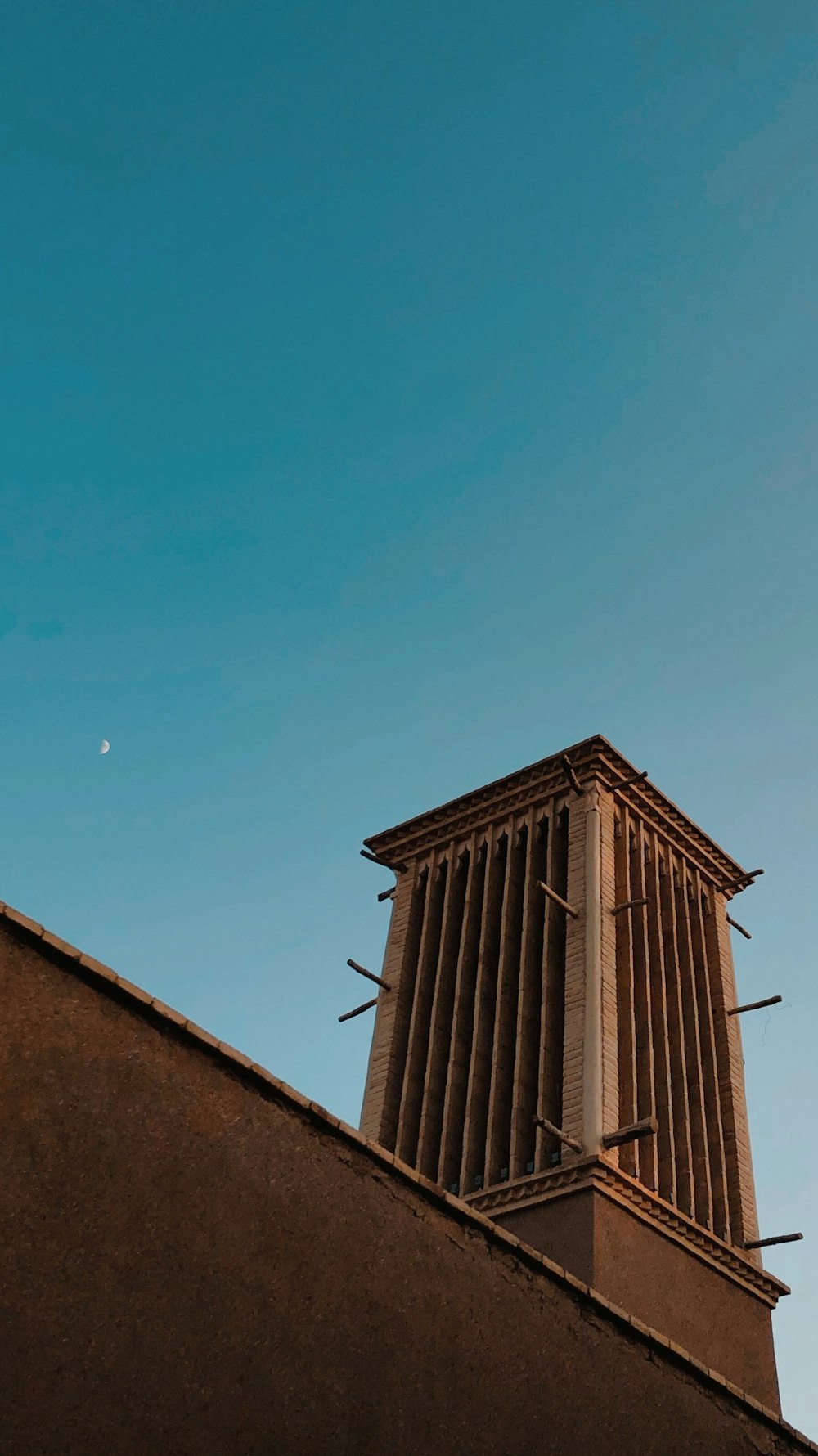 a tall building with a clock on the top of it