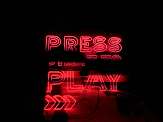 A vibrant neon-themed streaming service category with play buttons and digital waves.