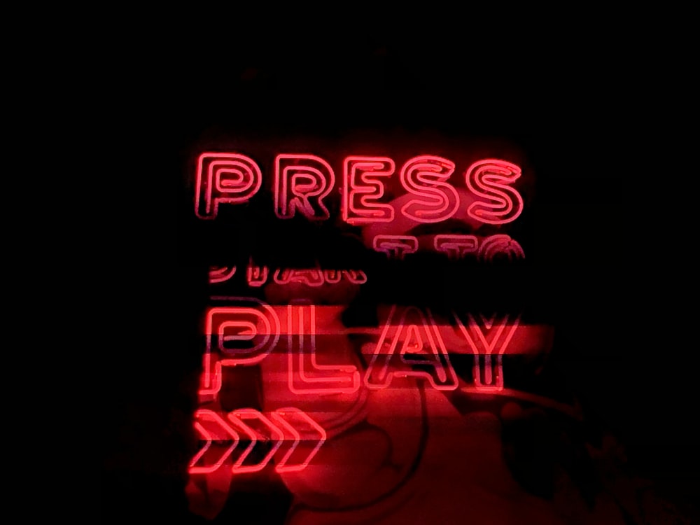 red Press Play neon sign