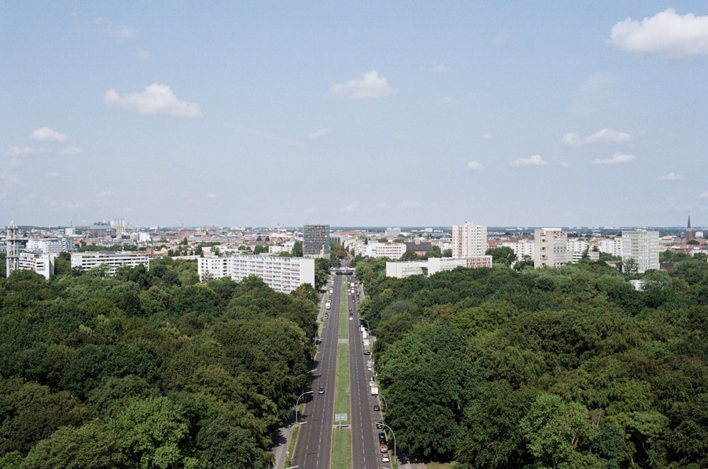 aerial photo of city buildings near green trees during daytime