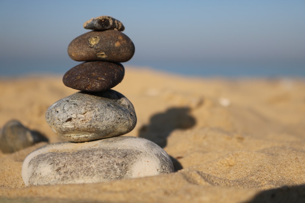 shallow focus photo of balance stone during daytime