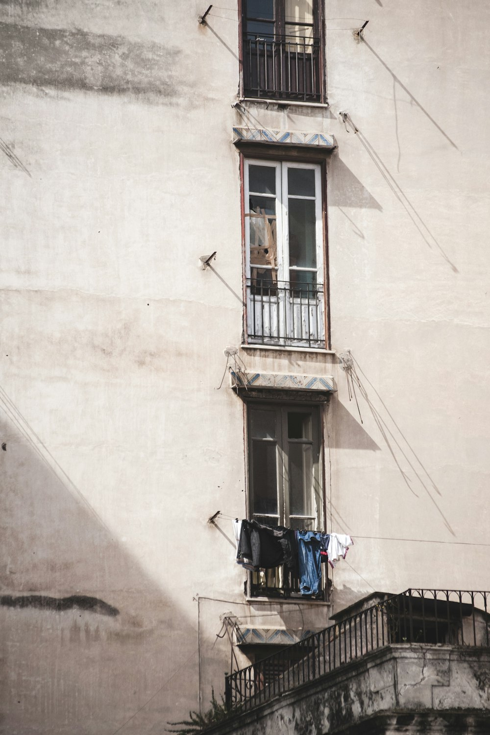 clothes hanging near at apartment window