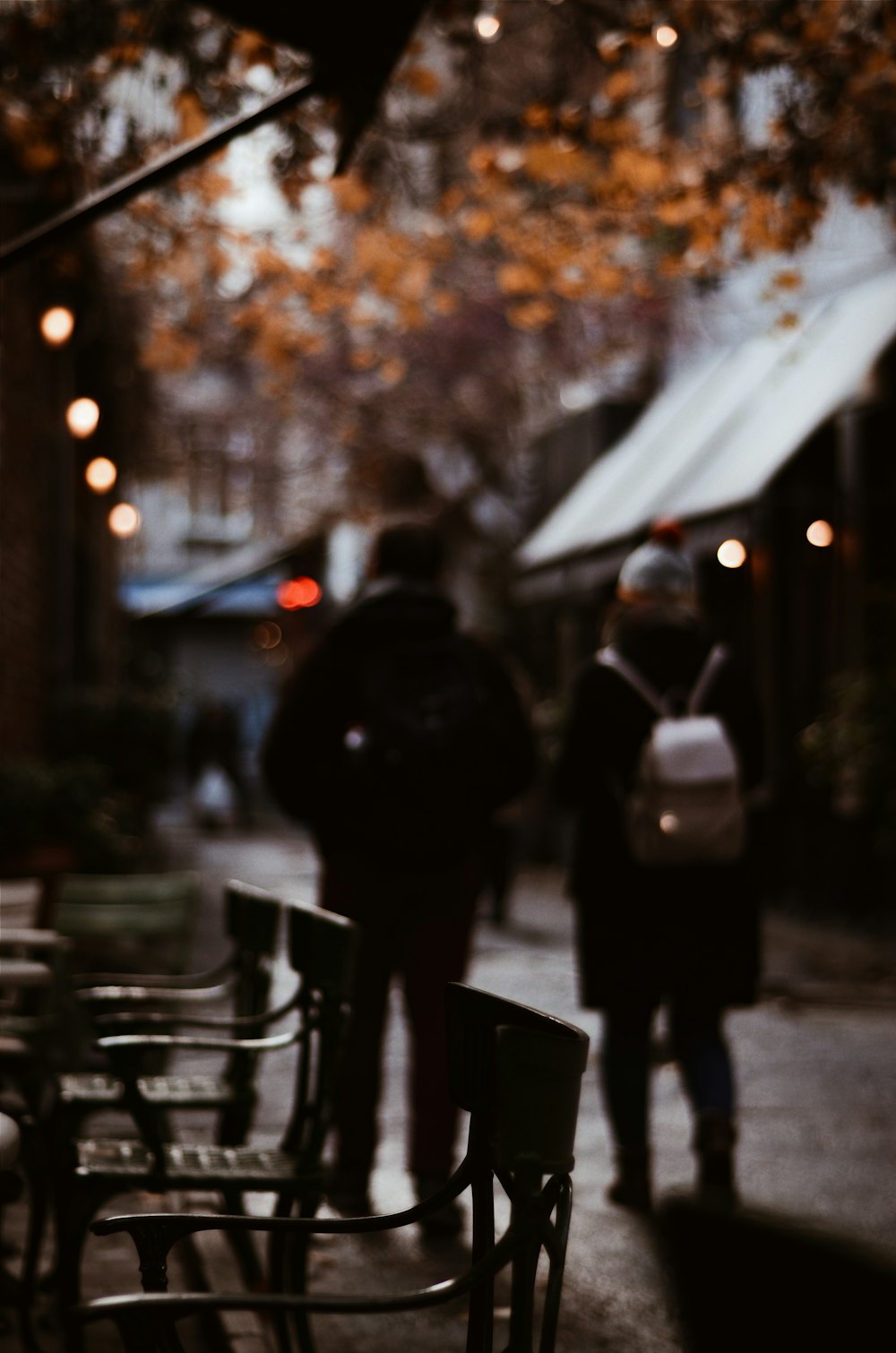shallow focus photography unknown persons walking outdoors