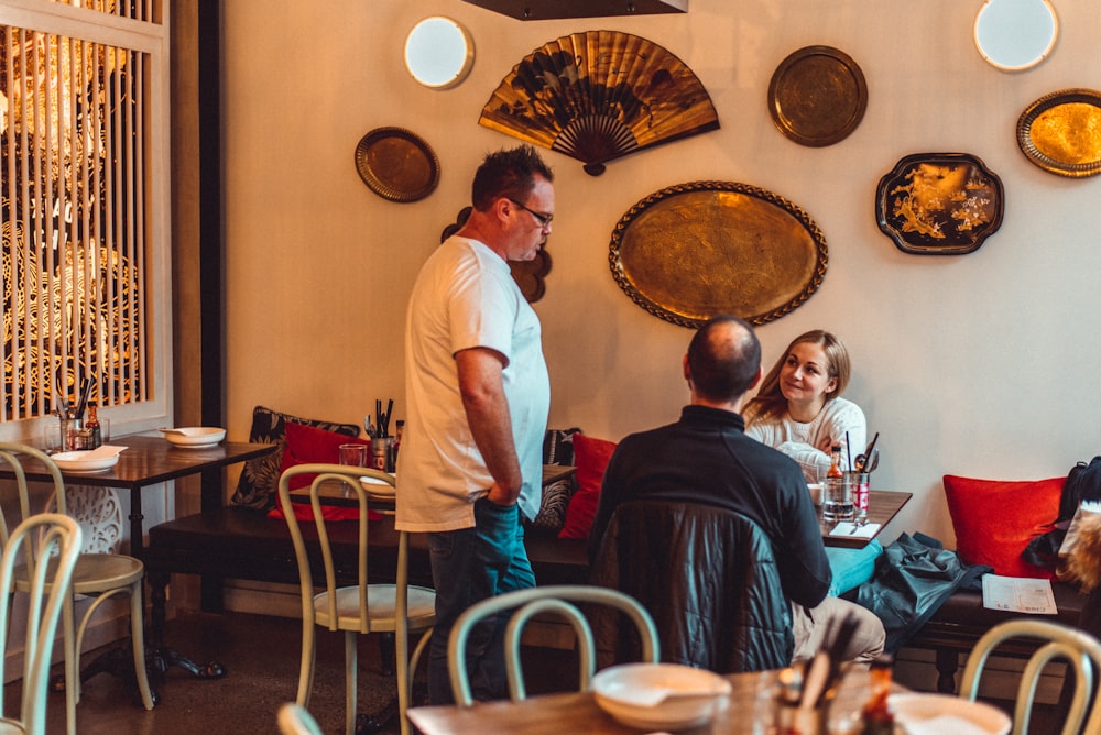 man standing in front of table