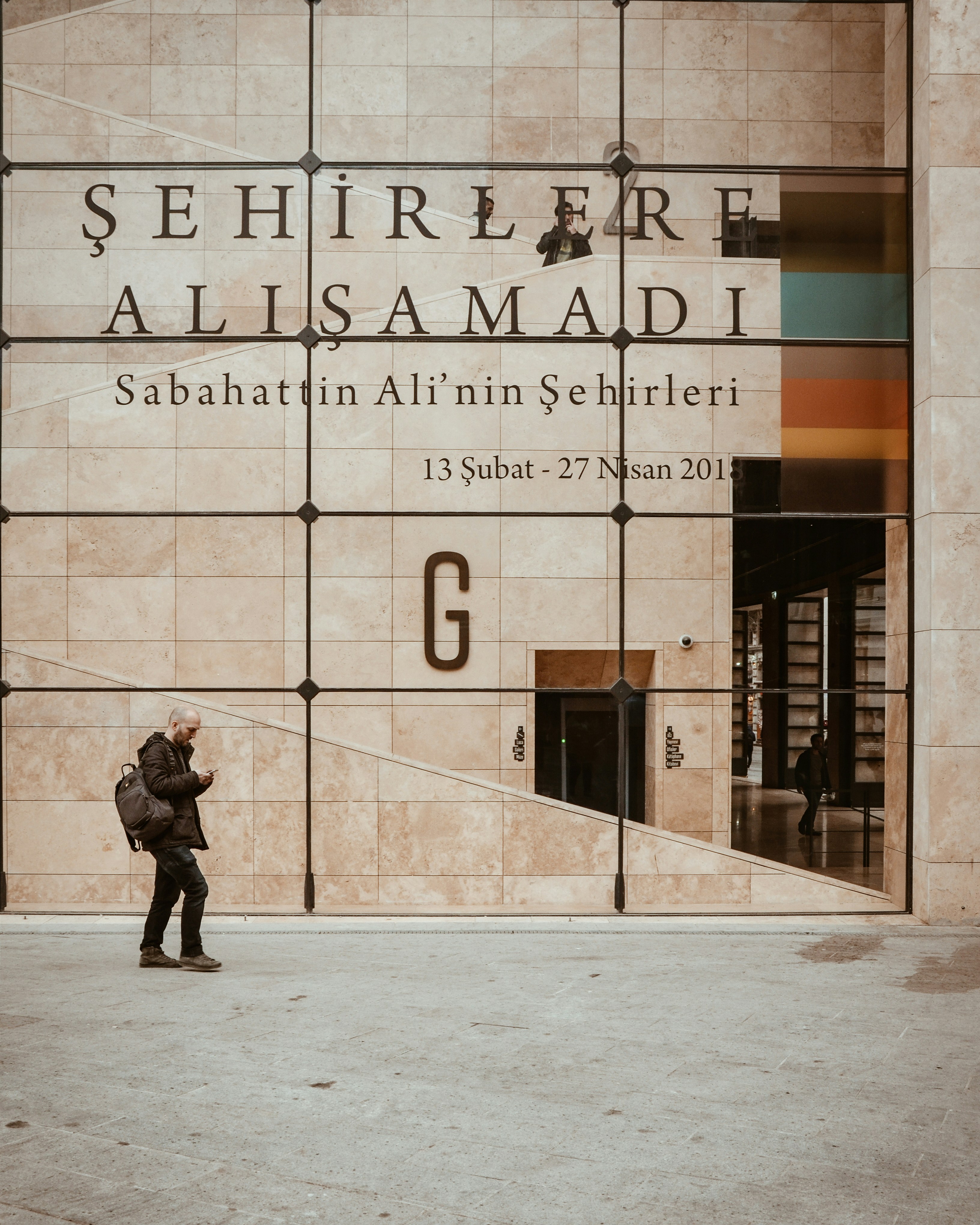 man walking beside structure