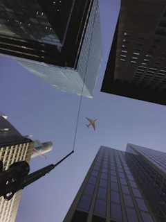 A sleek airplane flying over Chicago’s skyline with Lake Michigan in the background.