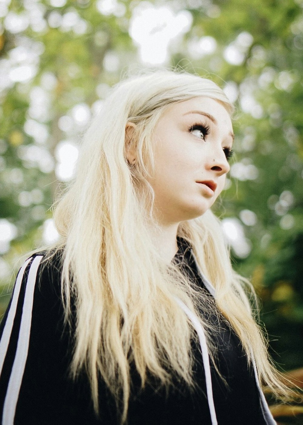 woman with blonde hair wearing black jacket