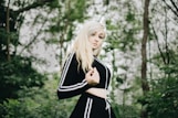 woman in white and black jacket standing outdoors