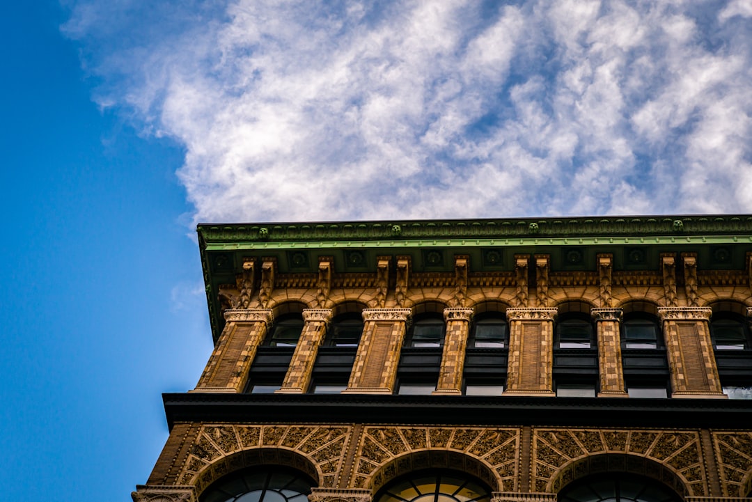 low angle photo of brown concrete building