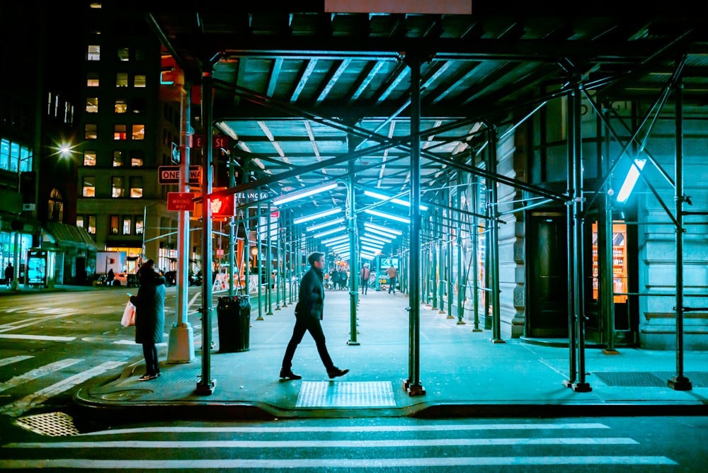 man walking on sidewalk