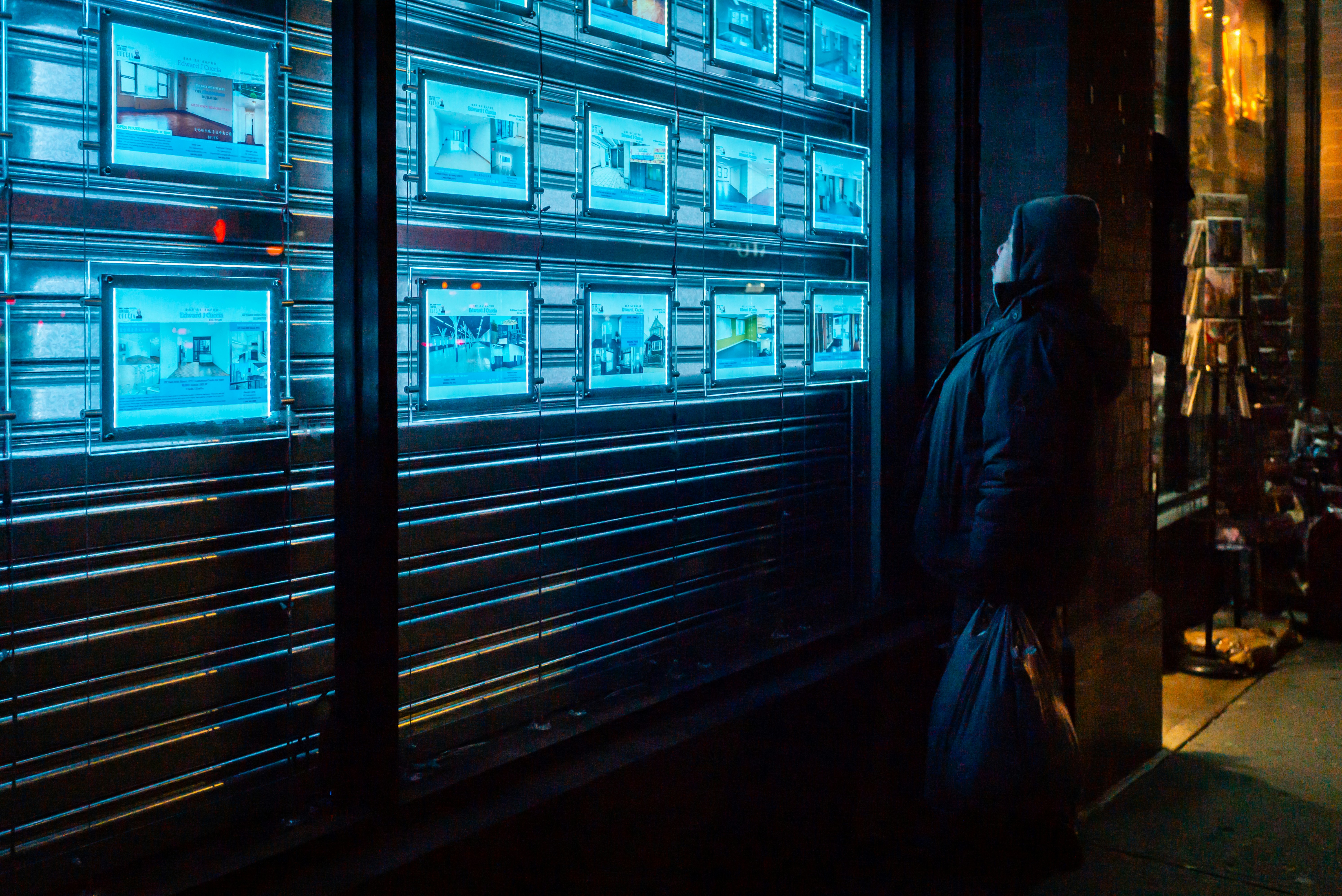 person standing beside wall